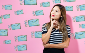 A lady thinking about how to grow her email marketing campaign.